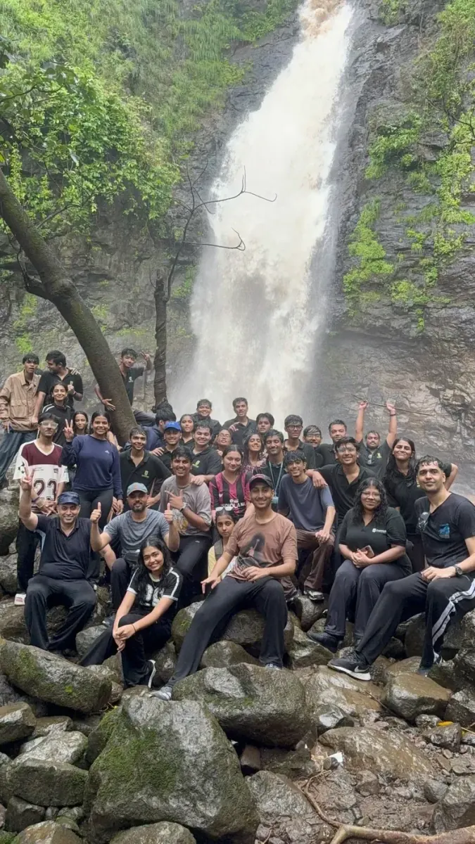 Cohort gathered at the waterfall during their outdoor excursion