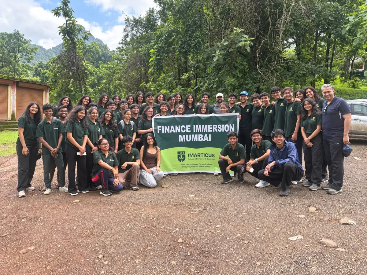 AI-edited trail cohort photograph with additional women and a Finance Immersion Mumbai banner